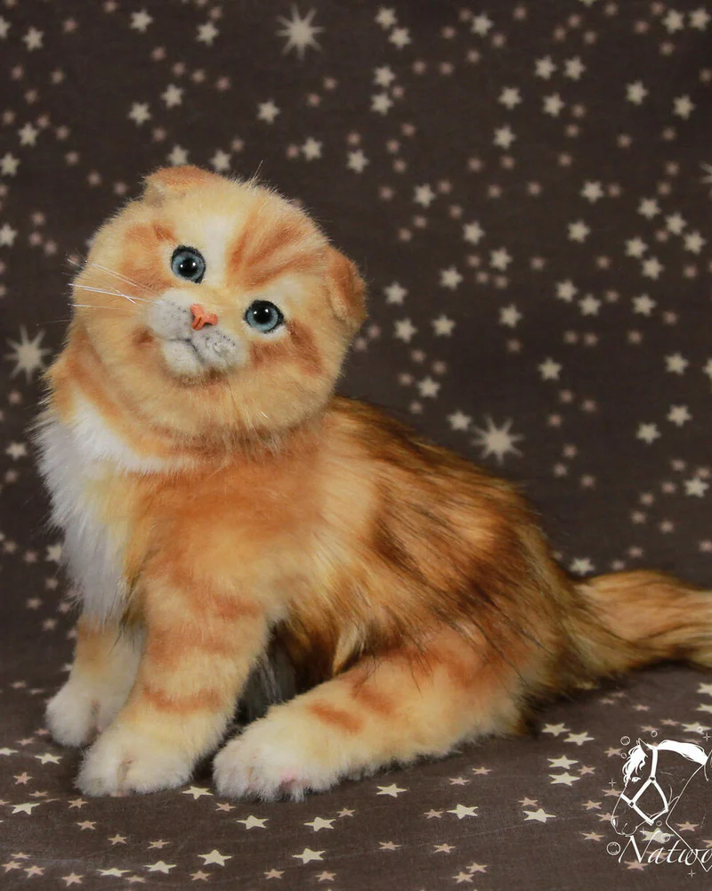 Реалистичный рыжий котенок