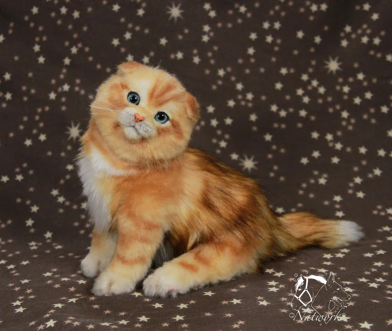 Реалистичный рыжий котенок